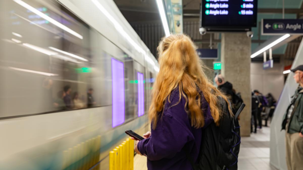 woman standing in subway station