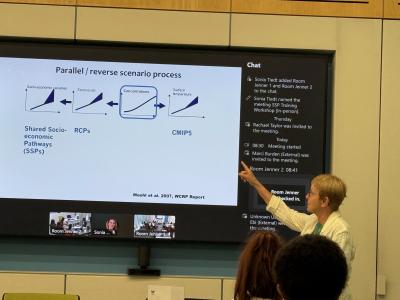 woman pointing at a screen